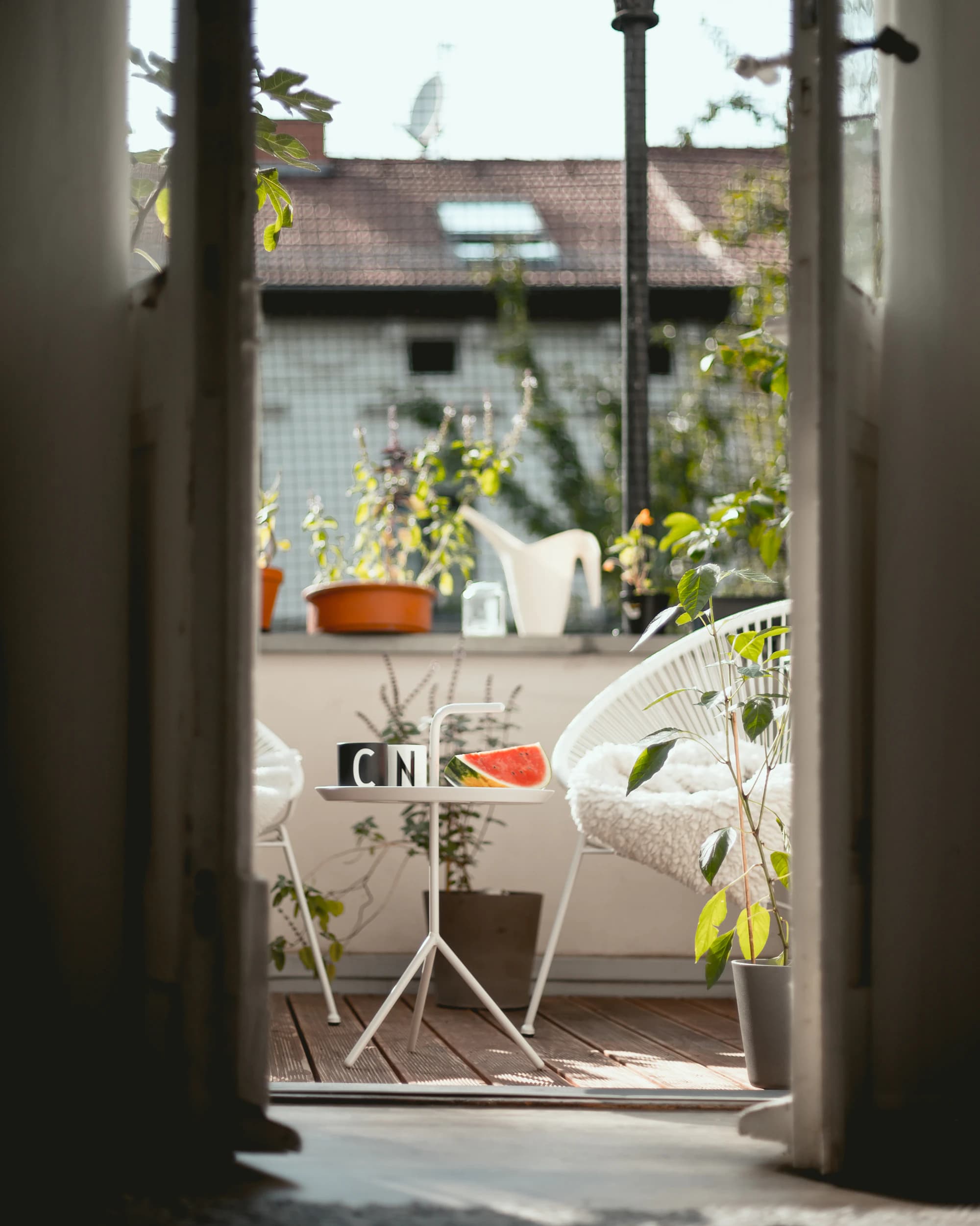 High-floor terrace composition capturing evening light over the district