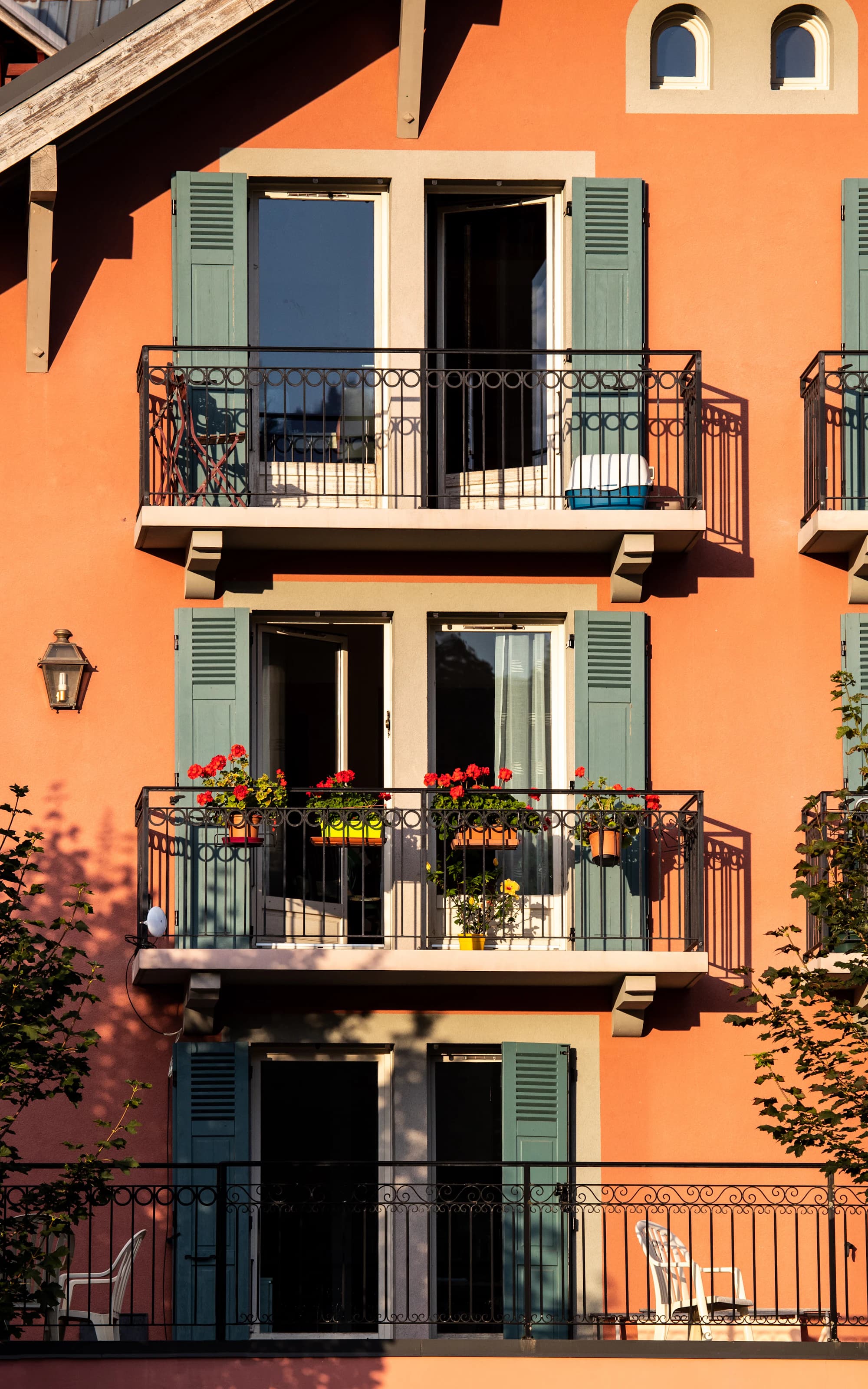 Compact outdoor balcony arrangement with greenery and coffee-time styling